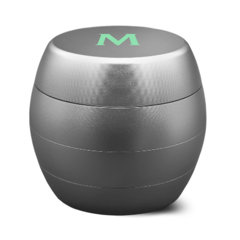 An image of the 'Mascotte Grinder - Design Aluminium' in a 40mm size, showcasing a stylish and compact herb grinder for breaking down dry herbs into a finer consistency.