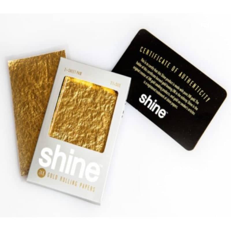 Photograph of Shine 24K Gold Rolling Papers, a luxurious choice for rolling cigarettes or other smoking materials, known for their genuine 24-karat gold leaf papers.