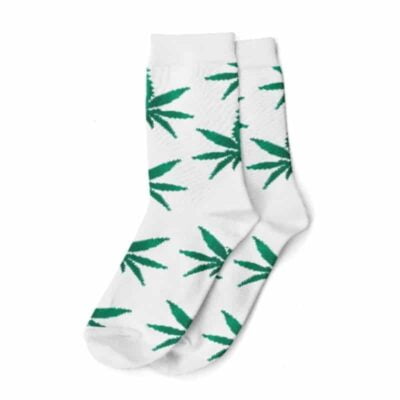 A pair of white and green weed-themed socks with intricate cannabis leaf patterns, perfect for cannabis enthusiasts.